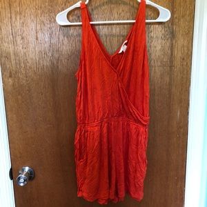 Red-orange romper with pockets size small